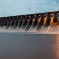 The Keystone Dam in Oklahoma with all the gates open and flowing a lot of water. Shot at Twilight.